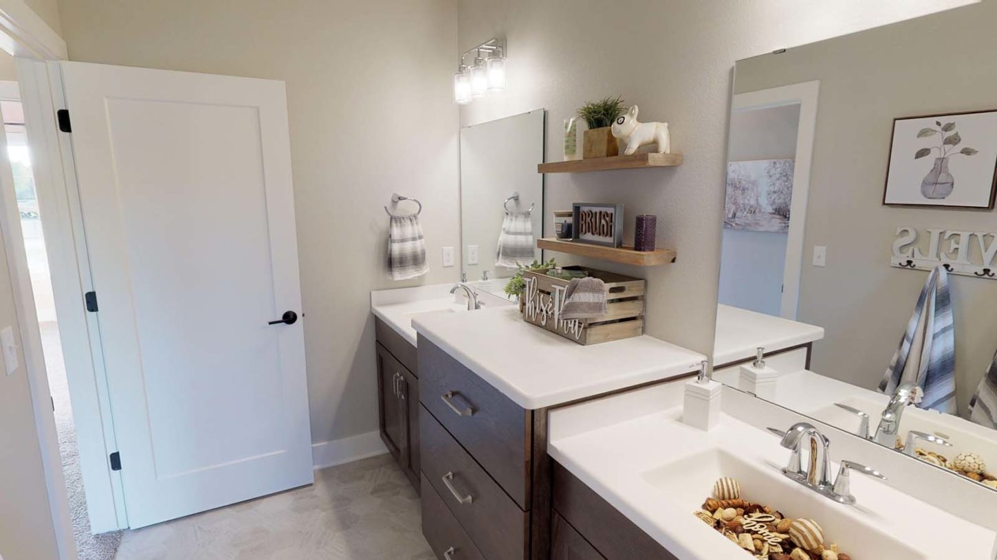 Demlang Builders - The Harper model home Jack and Jill bathroom