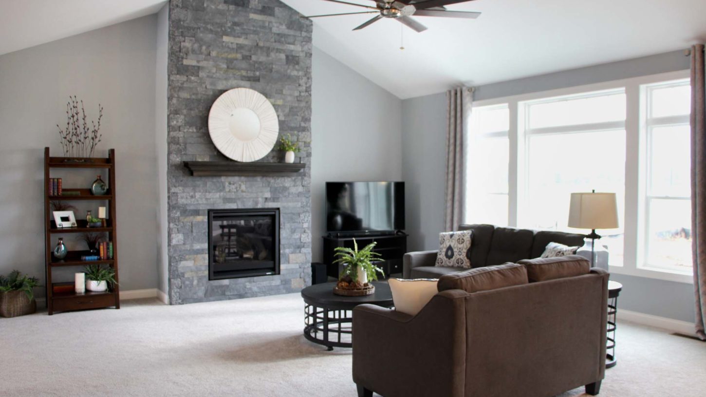 Living room with full-height fireplace in the Brooklyn model home