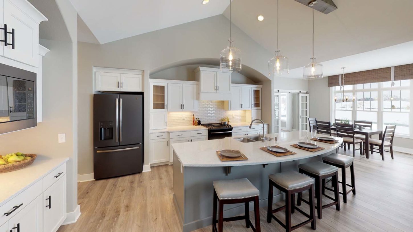 Kitchen with breakfast bar at Demlang Home Builder's model The Brooklyn