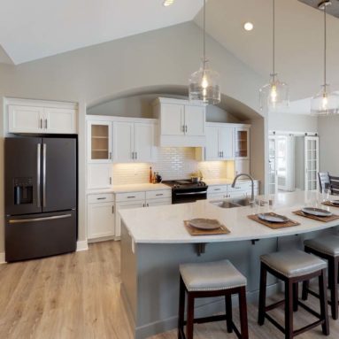 Kitchen with breakfast bar at Demlang Home Builder's model The Brooklyn