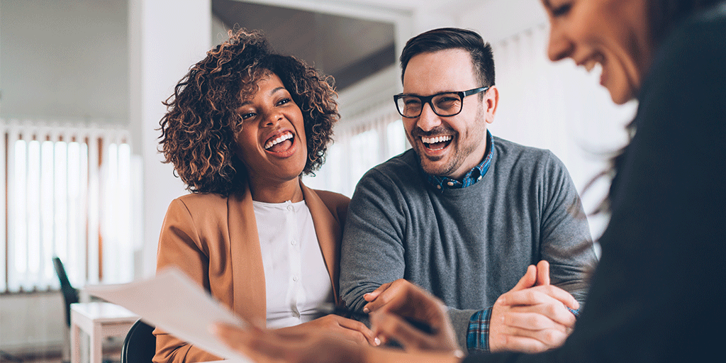 Happy couple talking with sales manager Happy couple talking with sales manager