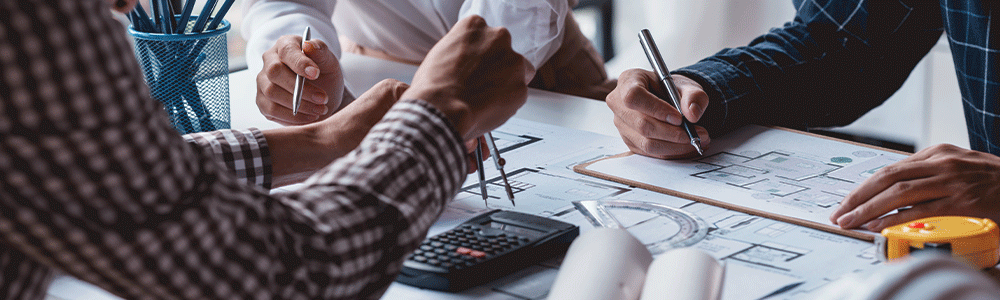 Architect or engineers are meeting to discuss home design. modify plans build a construction project and modify the work according to the needs of the customer. Architect or engineers are meeting to discuss home design. modify plans build a construction project and modify the work according to the needs of the customer.