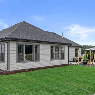 Parade of Homes model, The Lexi, exterior back yard showing off the sitting area with fireplace.