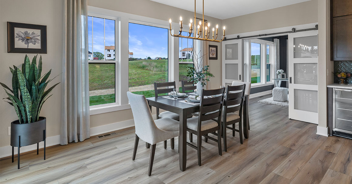 Parade of Homes model, The Lexi, dinning room with large picture windows looking to the backyard