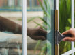 Cleaning home windows with a squeegee